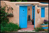Adobe style walls, blue doors and windows, and courtyard. Taos, New Mexico, USA