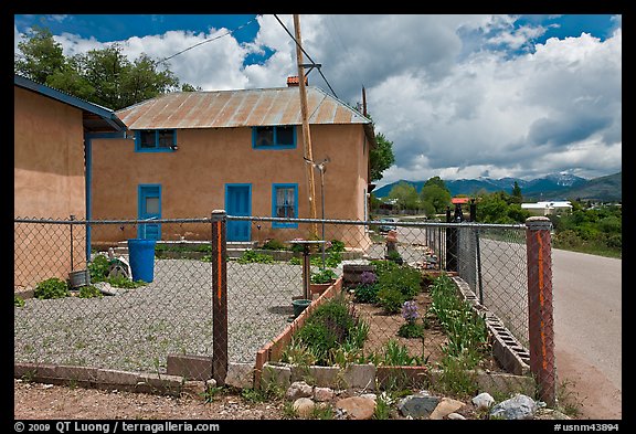 House with blue windows, Truchas. New Mexico, USA
