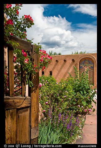 Gardens and adobe wall, Sanctuario de Chimayo. New Mexico, USA (color)