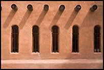 Facade with vigas (heavy timbers) extending through walls to support roof, Chimayo sanctuary. New Mexico, USA ( color)