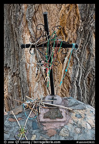 Metal cross festoned with rosaries, and crosses made of twigs, Sanctuario de Chimayo. New Mexico, USA (color)
