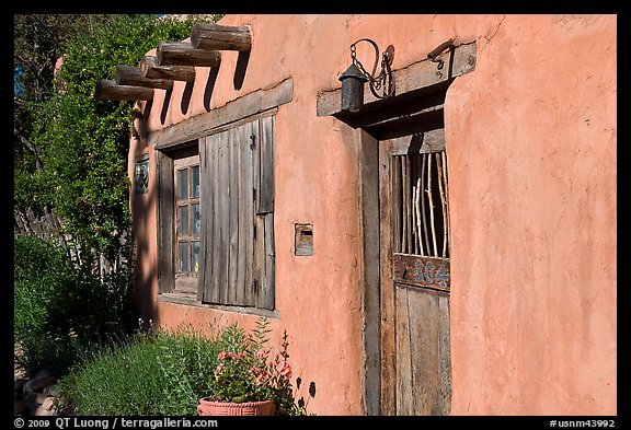 Door, window, and vigas (wooden beams). Santa Fe, New Mexico, USA (color)