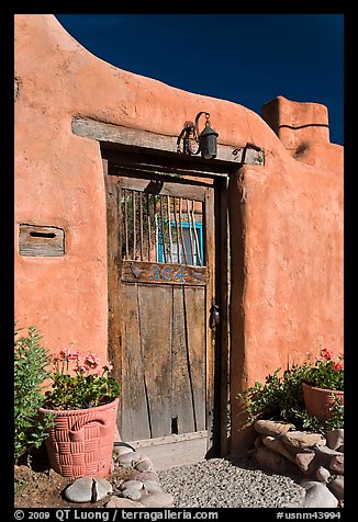 Wooden door and adobe wall. Santa Fe, New Mexico, USA (color)
