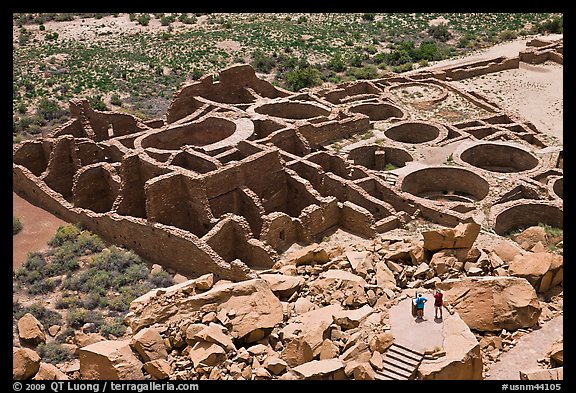 Tourists inspecting the complex room arrangement of Pueblo Bonito. Chaco Culture National Historic Park, New Mexico, USA