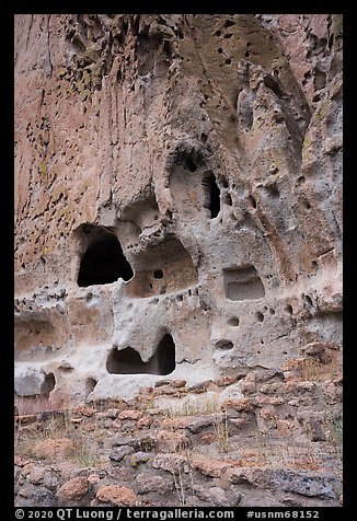Natureal cavities and architectural carvings in tuff wall. Bandelier National Monument, New Mexico, USA (color)