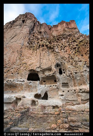 Cliff with multistory dwellings foundations and cavates. Bandelier National Monument, New Mexico, USA (color)