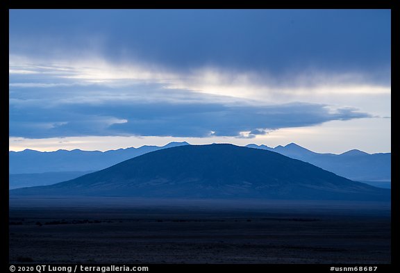 Ute Mountain with rain clouds at sunrise. Rio Grande Del Norte National Monument, New Mexico, USA (color)