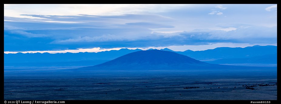 Ute Mountain, Taos Plateau, and Sangre de Cristo Mountains with rain clouds. Rio Grande Del Norte National Monument, New Mexico, USA