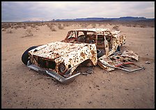 Car wreck used as a shooting target. Nevada, USA (color)