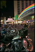 Harley-Davidson motorcycles on downtown street at night. Reno, Nevada, USA ( color)
