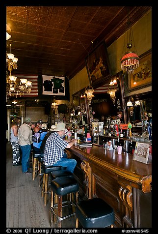 Men inside historic saloon. Virginia City, Nevada, USA