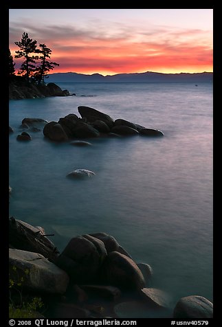Sunset over lake with boulders, Sand Harbor, East Shore, Lake Tahoe, Nevada. USA