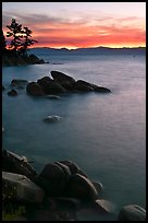 Sunset over lake with boulders, Sand Harbor, East Shore, Lake Tahoe, Nevada. USA