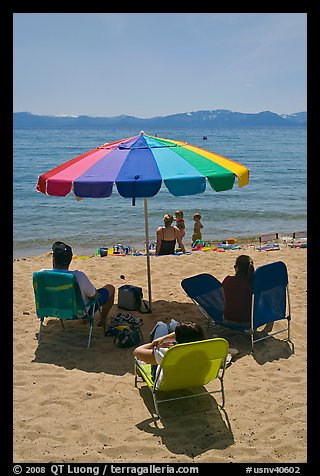 Beach unbrella and family, Sand Harbor, Lake Tahoe-Nevada State Park, Nevada. USA (color)