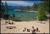 Young people sunbathing on sandy beach, Sand Harbor, Lake Tahoe, Nevada. USA ( color)
