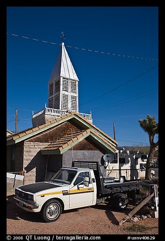 Truck and house with bell-tower, Beatty. Nevada, USA