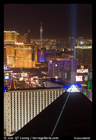 Luxor pyramid, casinos, and Stratosphere tower at night. Las Vegas, Nevada, USA