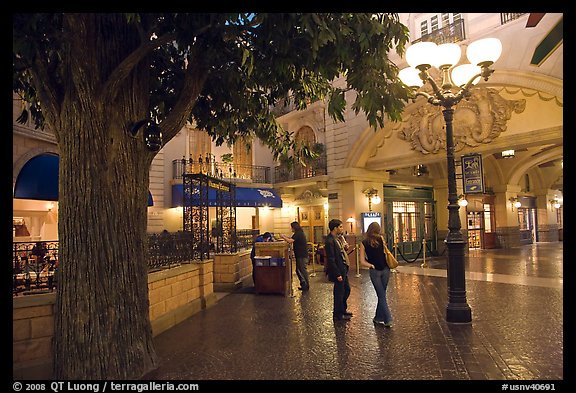 Man and woman standing on plaza inside Paris casino. Las Vegas, Nevada, USA