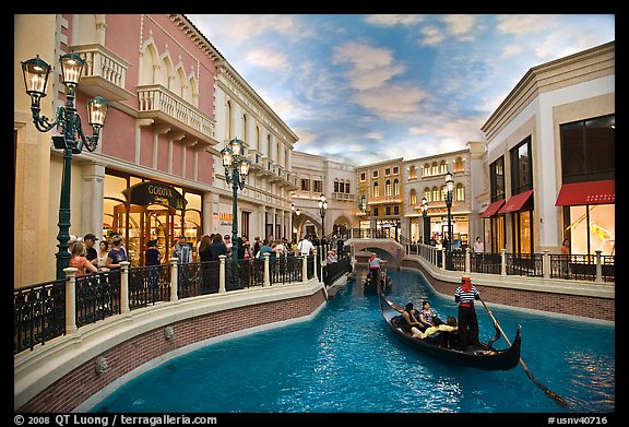 Gondolas and Grand Canal bordered by shops in the Venetian casino. Las Vegas, Nevada, USA (color)