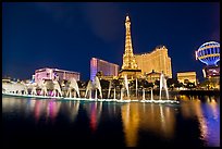 Paris casino and Bellagio fountains by night. Las Vegas, Nevada, USA