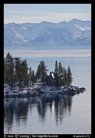 Cabin on lakeshore and snowy mountains, Lake Tahoe, Nevada. USA