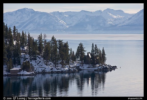 Lakeshore with houses and snow-covered mountains, Lake Tahoe, Nevada. USA