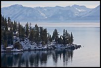 Lakeshore with houses and snow-covered mountains, Lake Tahoe, Nevada. USA ( color)