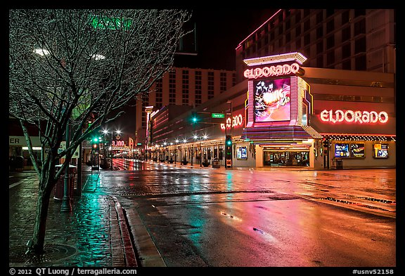 Main street with night reflections on wet pavement. Reno, Nevada, USA (color)