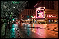 Main street with night reflections on wet pavement. Reno, Nevada, USA (color)