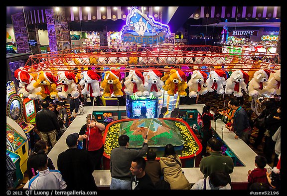 View from above of people playing carnival fishing game. Reno, Nevada, USA