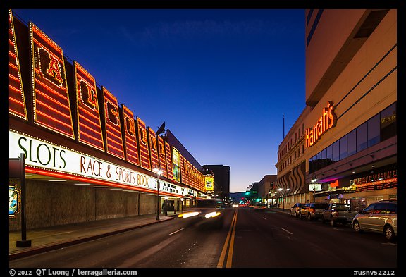 Casinos bordering street at dusk. Reno, Nevada, USA
