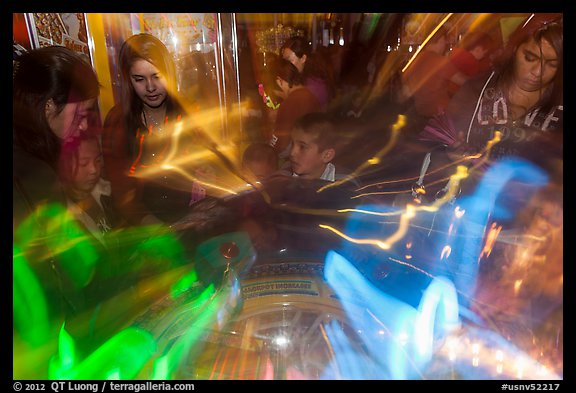 Fast moving lights and arcade game players. Reno, Nevada, USA (color)