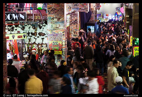 Holiday crowds in carnival game area. Reno, Nevada, USA