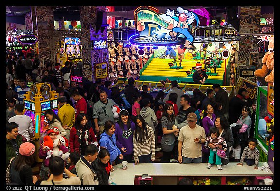 Families crowd arcade during holidays. Reno, Nevada, USA