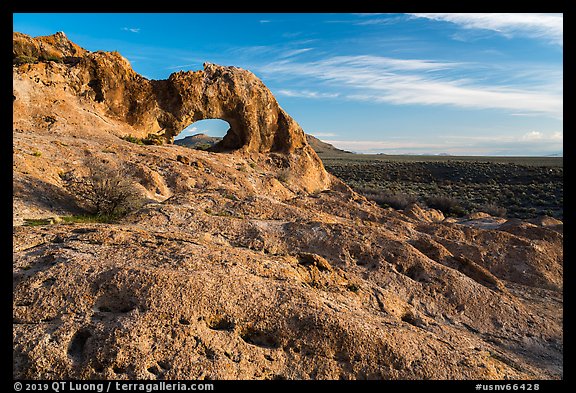 Slab and natural arch, early morning. Basin And Range National Monument, Nevada, USA