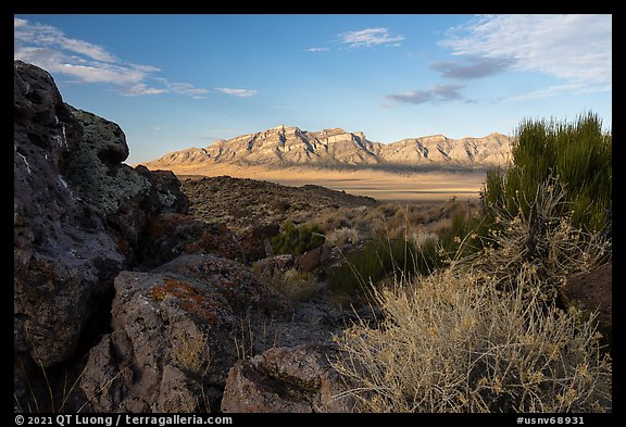 Ash boulders framing Worthington Mountains. Basin And Range National Monument, Nevada, USA