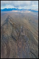 Aerial view of part of Michael Heizer's City leading to mountains. Basin And Range National Monument, Nevada, USA ( color)