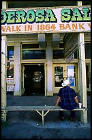 Man with cowboy hat sitting in front of a casino. Virginia City, Nevada, USA ( color)