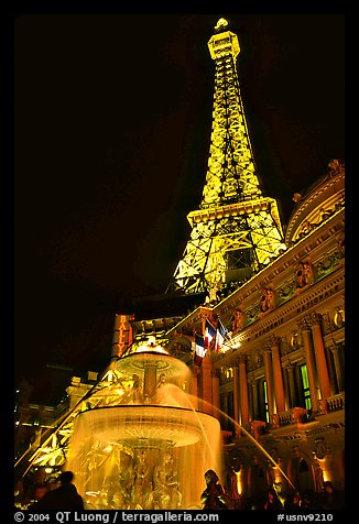 Fountain, opera house and Eiffel tower, Paris Las Vegas by night. Las Vegas, Nevada, USA (color)