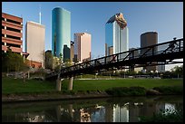 Bridge with bicyclist, reflection, and skyline. Houston, Texas, USA ( color)