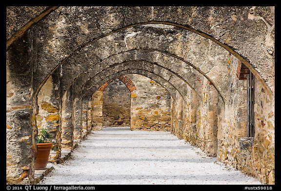 Arched walkway leading to the church, Mission San Jose. San Antonio, Texas, USA (color)