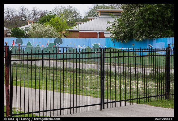 Fence with landscape mural decor. San Antonio, Texas, USA