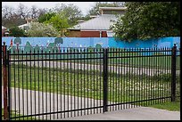 Fence with landscape mural decor. San Antonio, Texas, USA