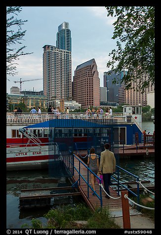 Walking into tour boat on Colorado River. Austin, Texas, USA (color)