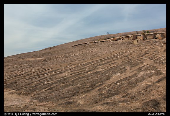 Granite dome with hikers, Enchanted Rock. Texas, USA