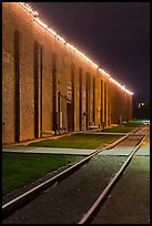 Railroad tracks and brick buildings at night, Stockyards. Fort Worth, Texas, USA ( color)