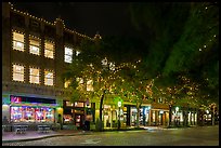 Street at night with lighted stores. Fort Worth, Texas, USA ( color)