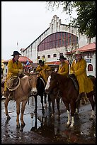 Cowboys in raincoats in front of Cowtown coliseum. Fort Worth, Texas, USA ( color)