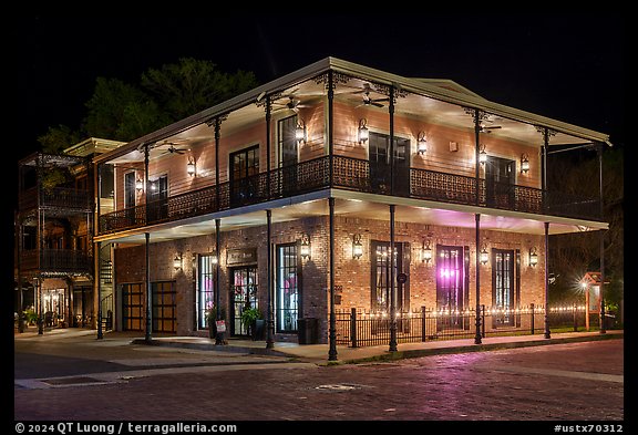 House with wrought iron balconies at night. Jefferson, Texas, USA (color)