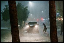 Pedestrian run in torrential rain at night. San Antonio, Texas, USA ( color)